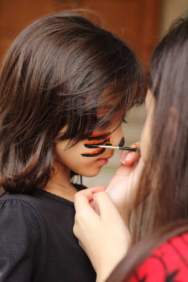 a child getting a face paint
